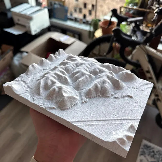 Handheld 3D printed mountain map showing terrain detail, perfect for hikers and adventure lovers