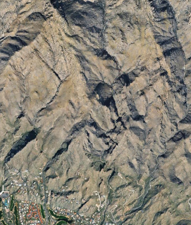 Satellite reference of the small mountainous area showing vegetation, rock, roads, and developed land.
